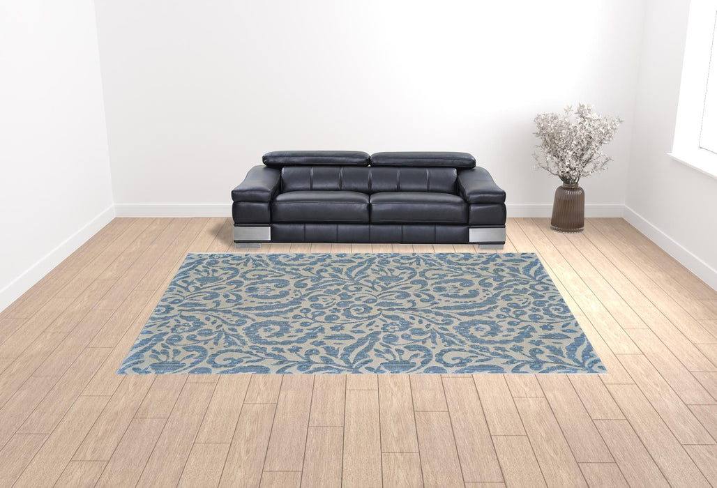 10' X 14' Blue Ivory And Tan Floral Distressed Stain Resistant Area Rug