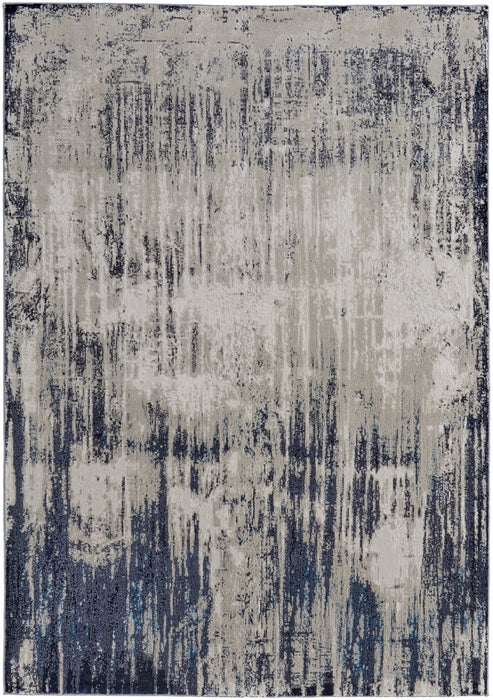 10' X 13' Tan Blue And Ivory Abstract Power Loom Distressed Area Rug