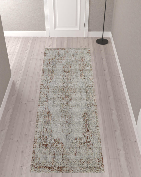 10' Tan Ivory And Orange Floral Power Loom Distressed Runner Rug With Fringe